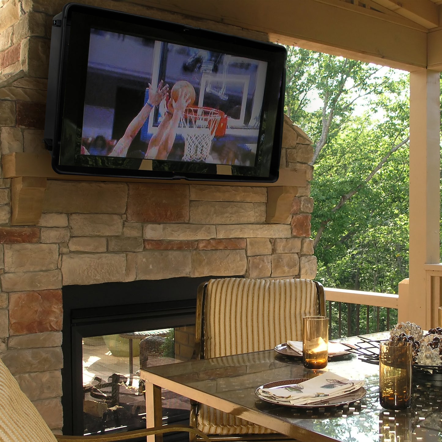 Storm Shell TV cover outdoors under patio: Weather proof TV cover under a patio covering open with tv on.